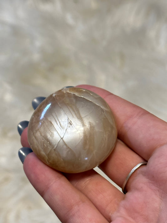 Flashy peach moonstone palmstone