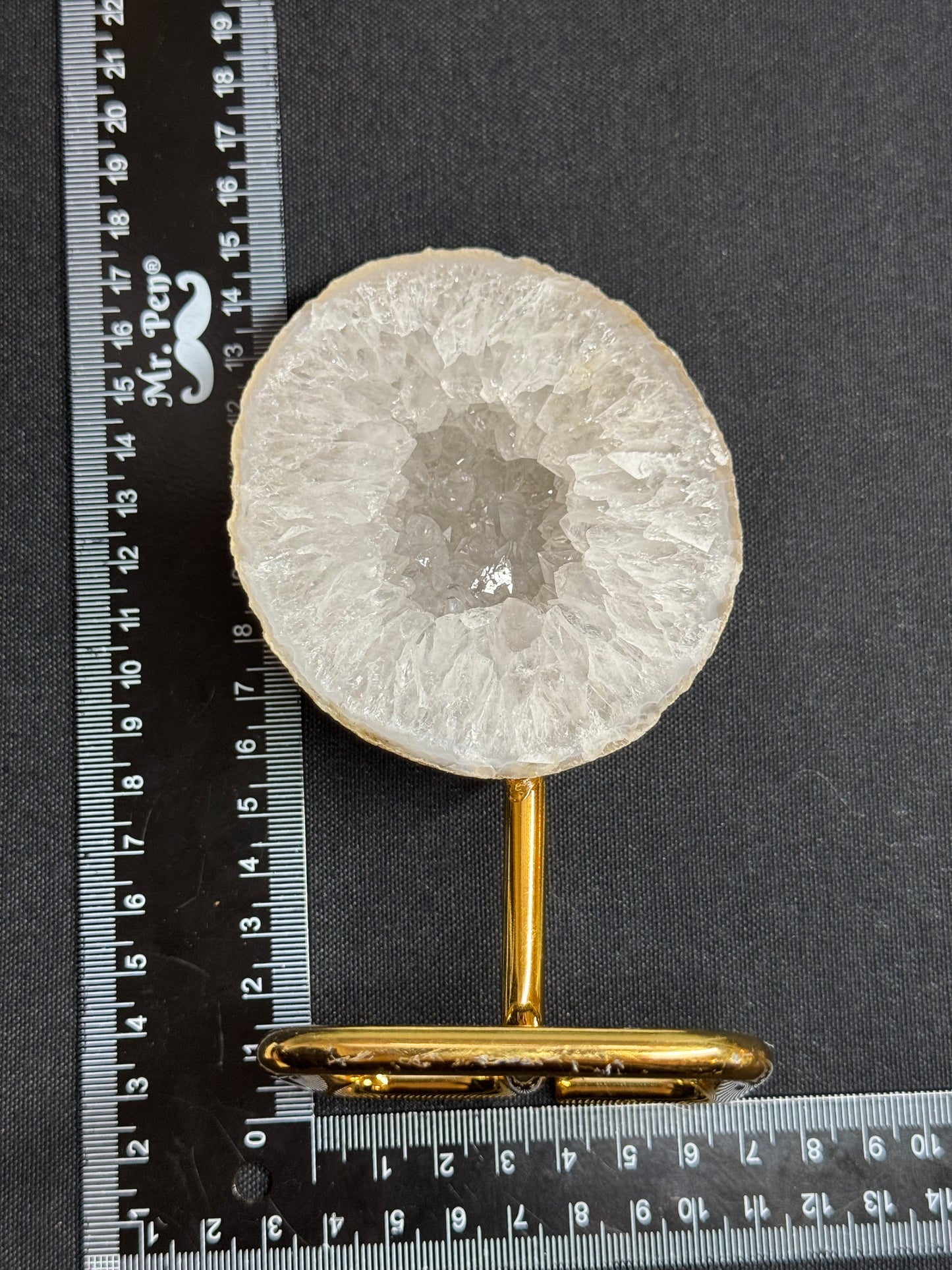 Agate geode half on gold stand