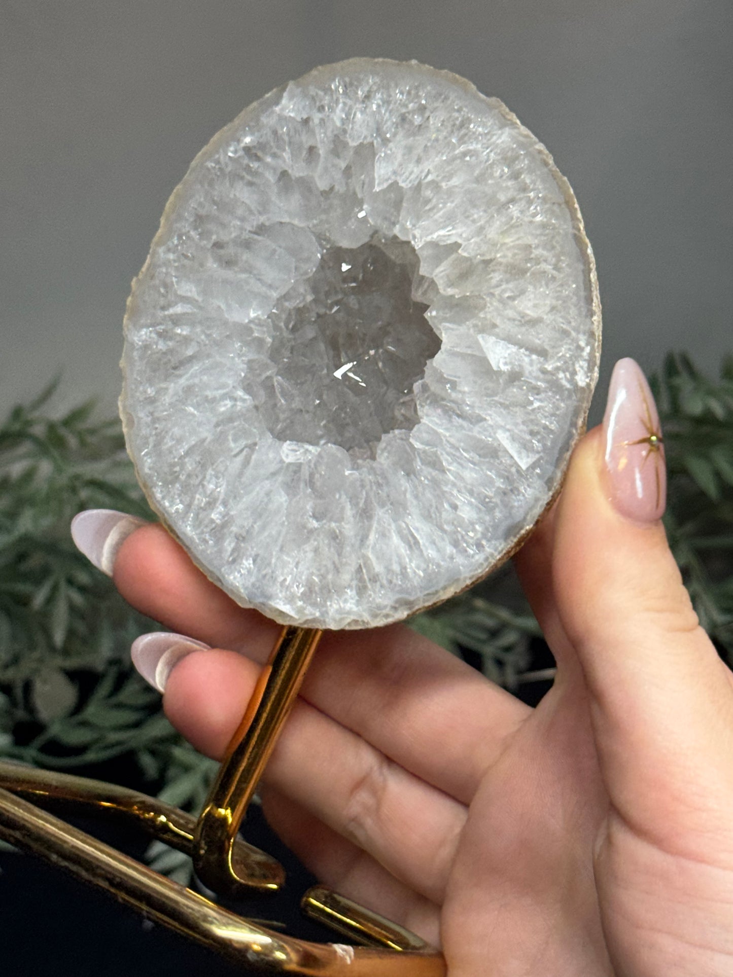 Agate geode half on gold stand